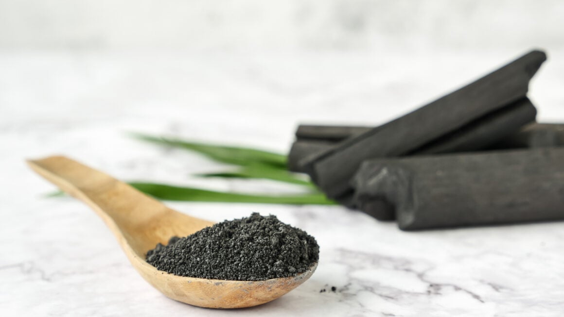 Activated carbon powder on marble table.