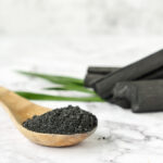 Activated carbon powder on marble table.