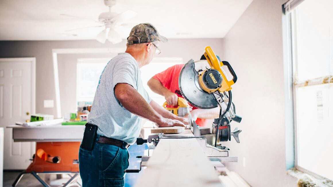 men working on the interior of a house