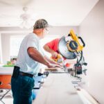 men working on the interior of a house